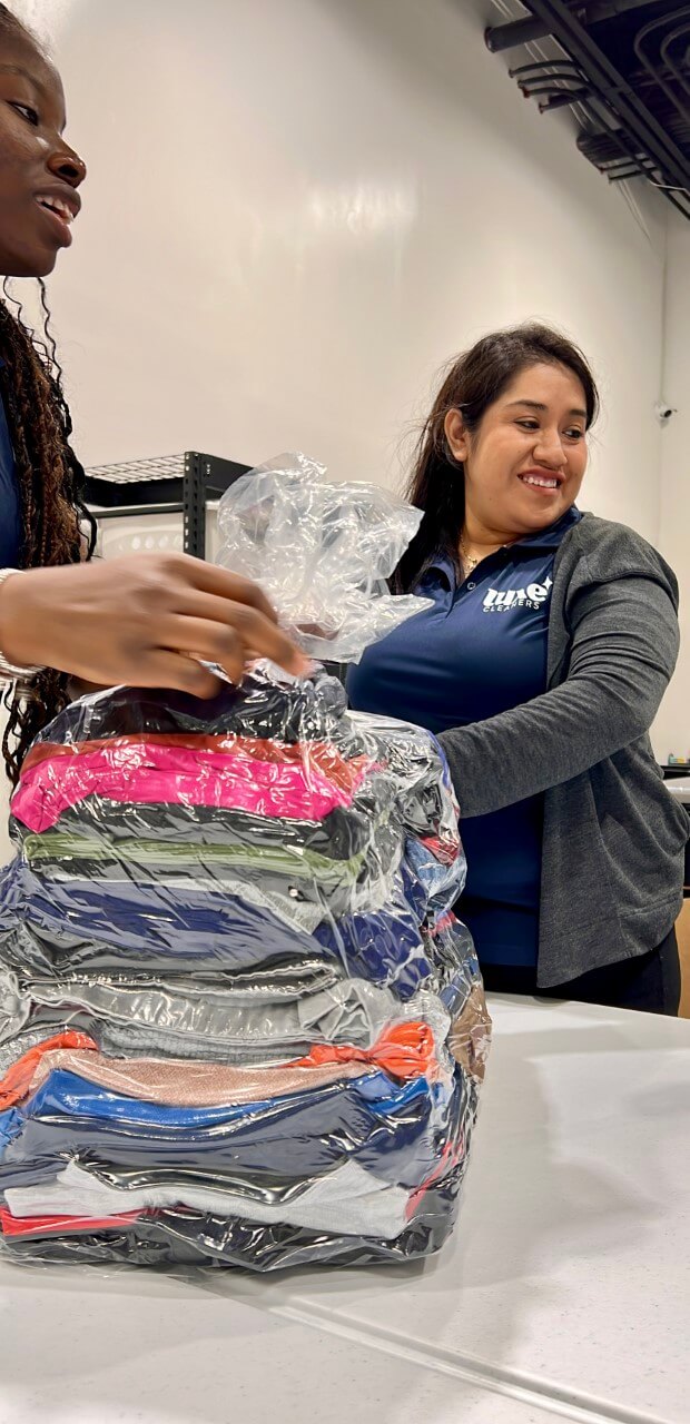 luxe laundry staff smiling